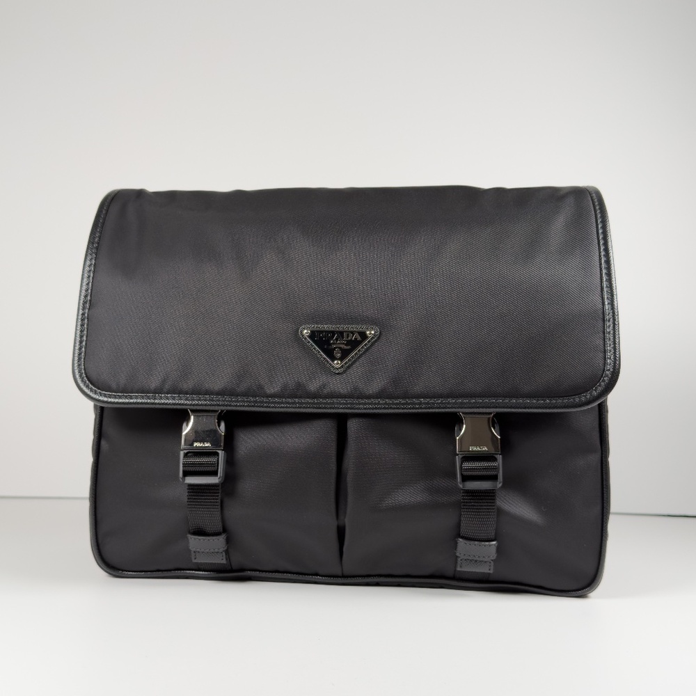 Brand new Prada Re-Nylon and Saffiano leather shoulder bag in black.